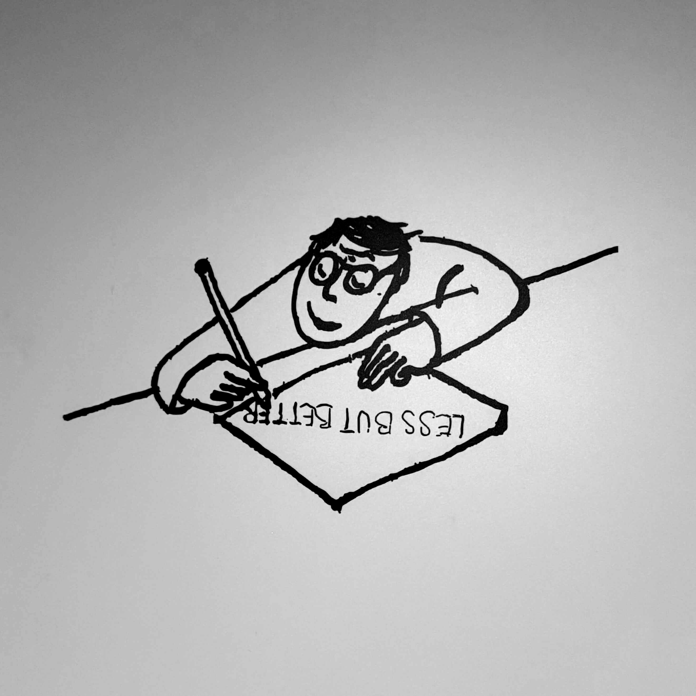 A hand-drawn person writing Less But Better on a sheet of paper.